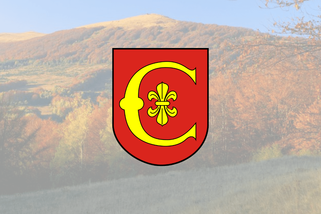 Aktualności - domyślne tło przedstawiające herb Gminy na tle krajobrazu górzystego